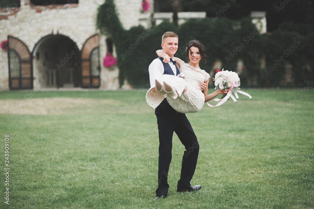 Fototapeta premium Luxury married wedding couple, bride and groom posing in old city