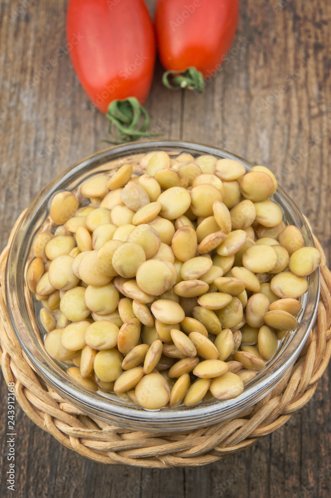 Raw lentils on wooden table Raw lentils on wooden table