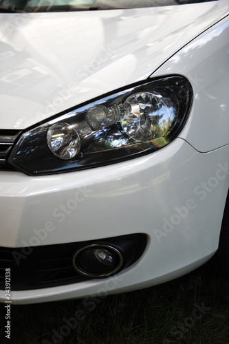 headlight of the main light of the white car, close-up. © ruslan_shramko
