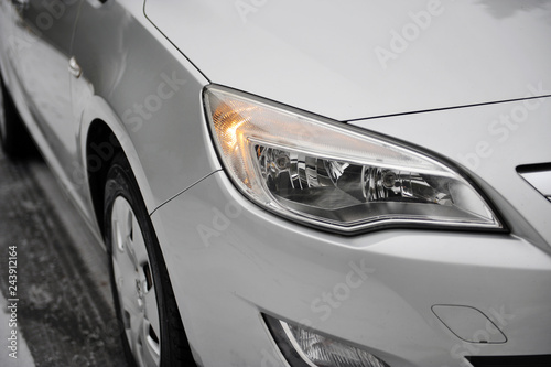 headlight of the main light of the white car, close-up. © ruslan_shramko