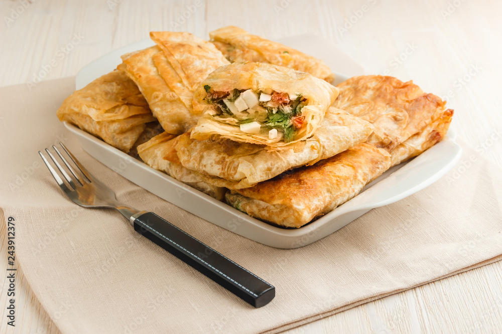 Sandwiches in Armenian pita bread made of eggs, cheese, tomato and parsley Sandwiches in Armenian pita bread made of eggs, cheese, tomato and parsley