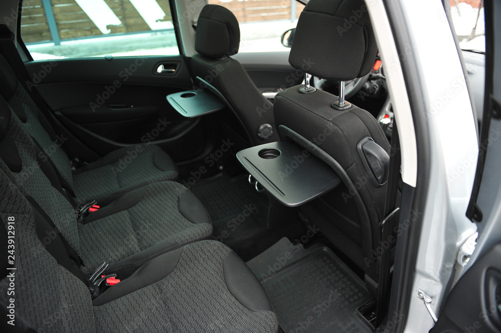 New car inside. Clean car interior. Black back seats transformer in sedan. Car cleaning theme. New car inside. Clean car interior. Black back seats transformer in sedan. Car cleaning theme.