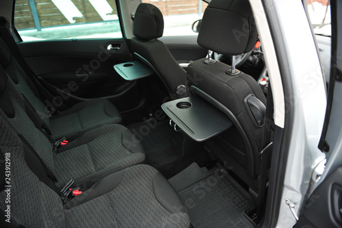 New car inside. Clean car interior. Black back seats transformer in sedan. Car cleaning theme. © ruslan_shramko