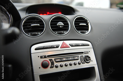 controls near the steering wheel in a modern car © ruslan_shramko