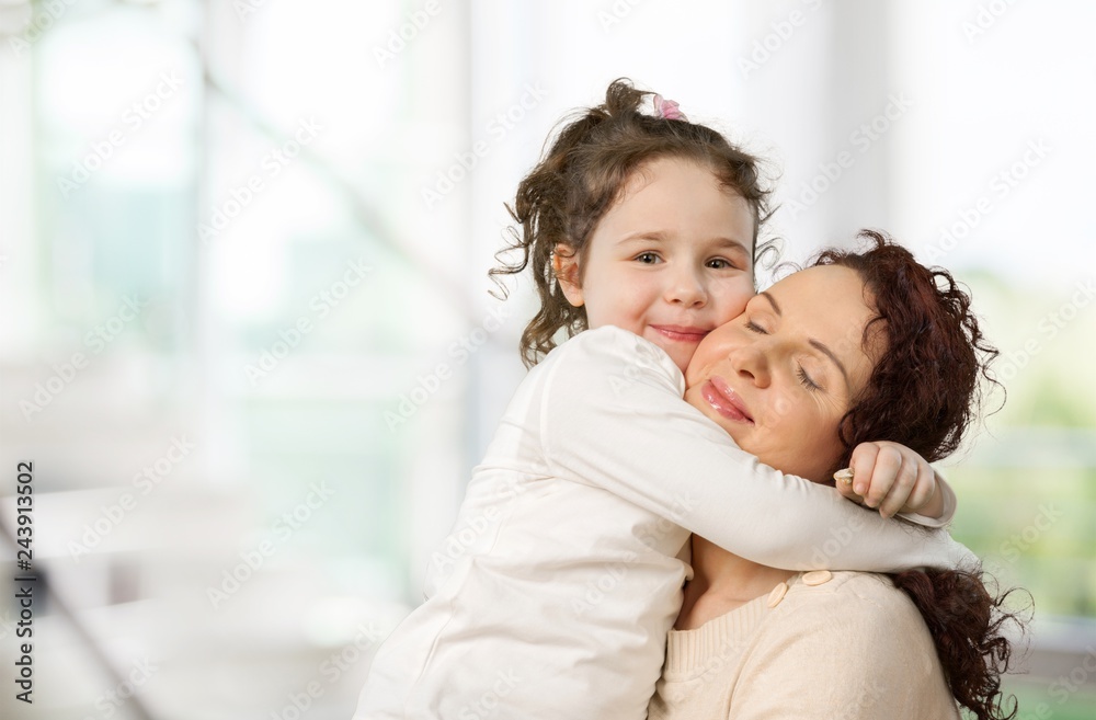 Happy Mother and daughter hugging Happy Mother and daughter hugging