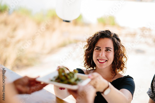 Content woman receiving meal in food truck