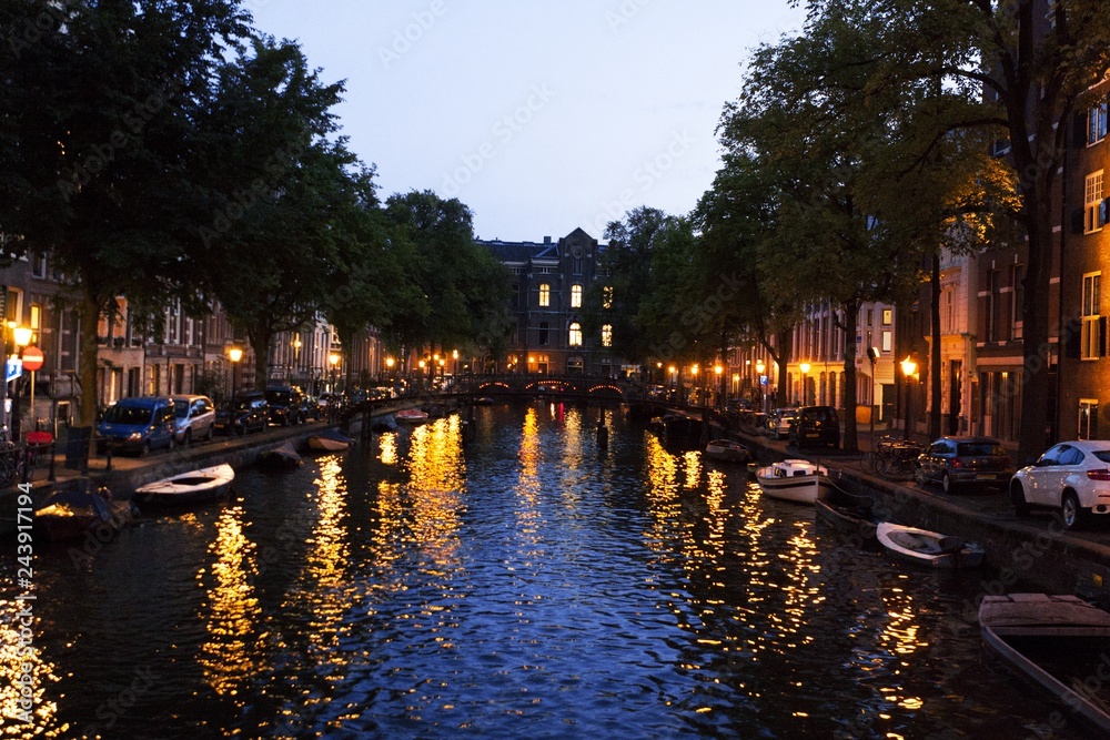 Boats and Buildings on a Canal at Twilight