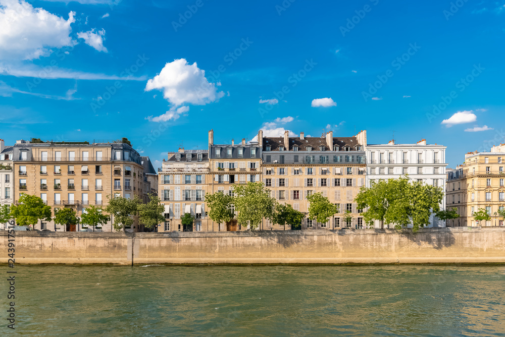 Paris, view of ile saint-louis and quai d'Orleans, beautiful buildings and quays in summer 
