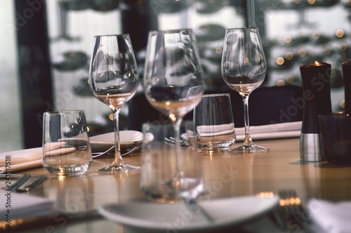 empty wine glasses on table © Elena Bandurka