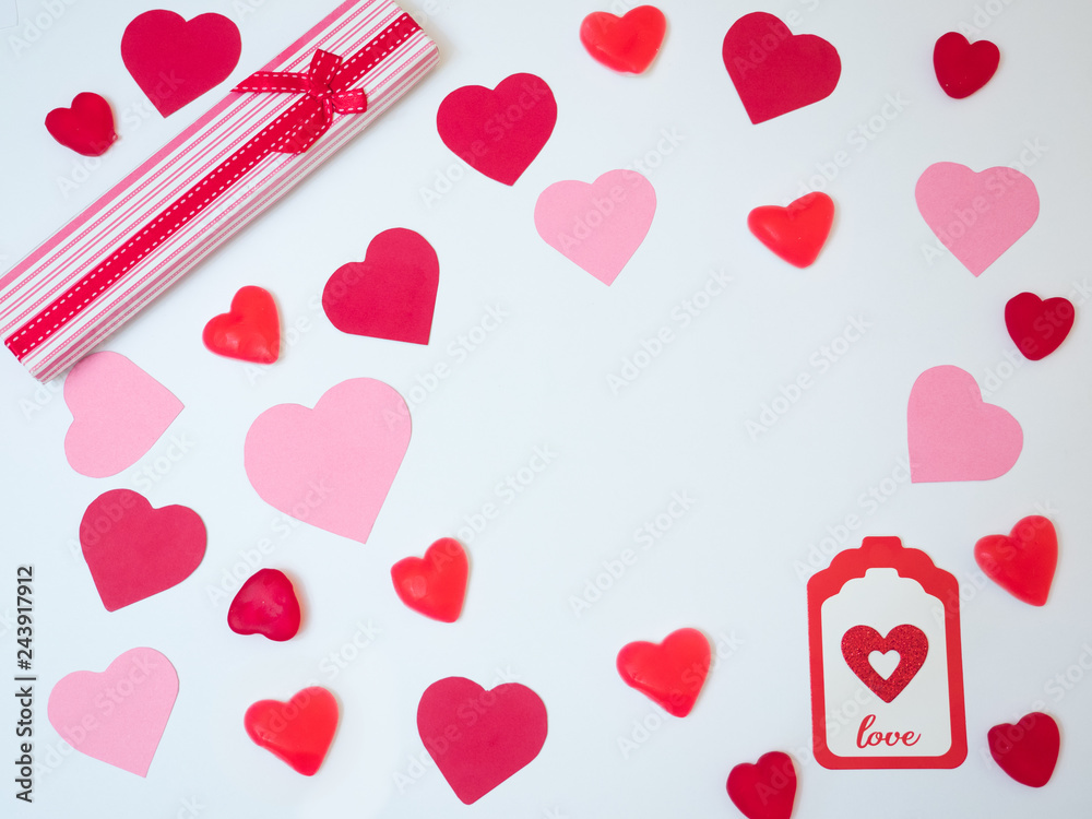 San Valentine´s day decoration card made with red and pink paper hearts and a gift box