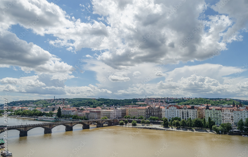 Old bridge in Prague. Great place to travel. Bird's eye view. Day, bright sun, sky and clouds. Vltava, Prague, city, bridge, Czech Republic.