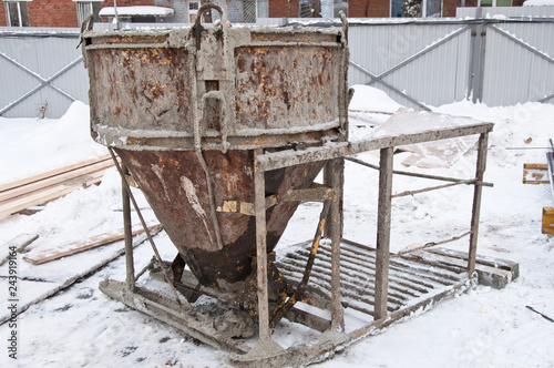 Concrete bucket used in pouring concrete. Technologies for concreting works. © Vasiliy Ulyanov