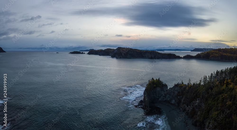 Aerial panoramic Canadian Landscape View by the Atlantic Ocean Coast during a cloudy sunrise. Taken in Beachside, Newfoundland, Canada.