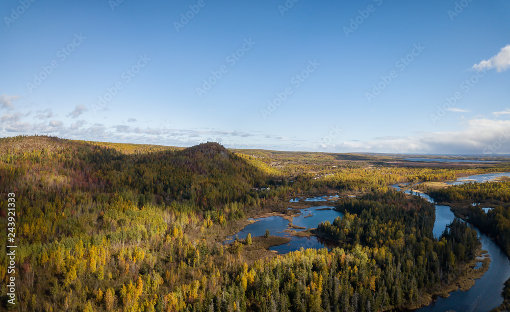 Aerial panoramic view of a beautiful Canadian Landscape during a sunny day in the Autumn. Taken near Grand Falls-Windsor, Newfoundland, Canada.