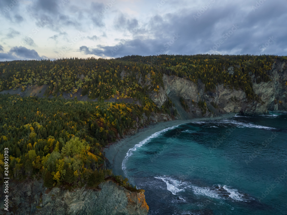 Aerial Canadian Landscape View by the Atlantic Ocean Coast during a cloudy sunrise. Taken in Beachside, Newfoundland, Canada.