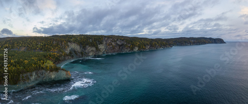 Aerial panoramic Canadian Landscape View by the Atlantic Ocean Coast during a cloudy sunrise. Taken in Beachside, Newfoundland, Canada.