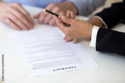 Businesswoman giving pen to man, applicant, offer to sign employment contract, manager convincing client agree with terms and conditions, put signature on legal document, close up hands view