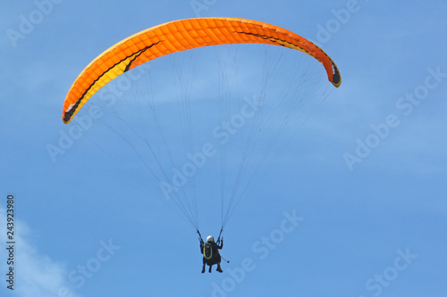 Tandem paraglider flying