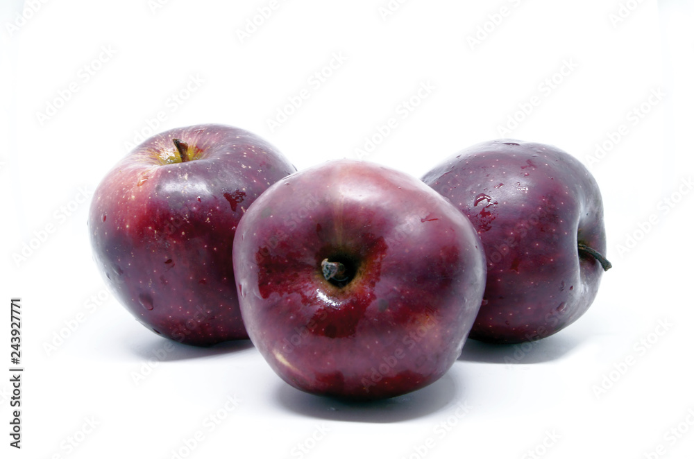 Several wet red apples
