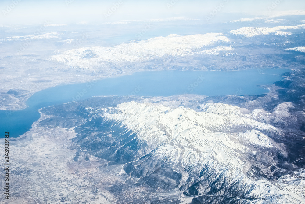 Fototapeta premium Beautiful earth and sea from a window airplane background