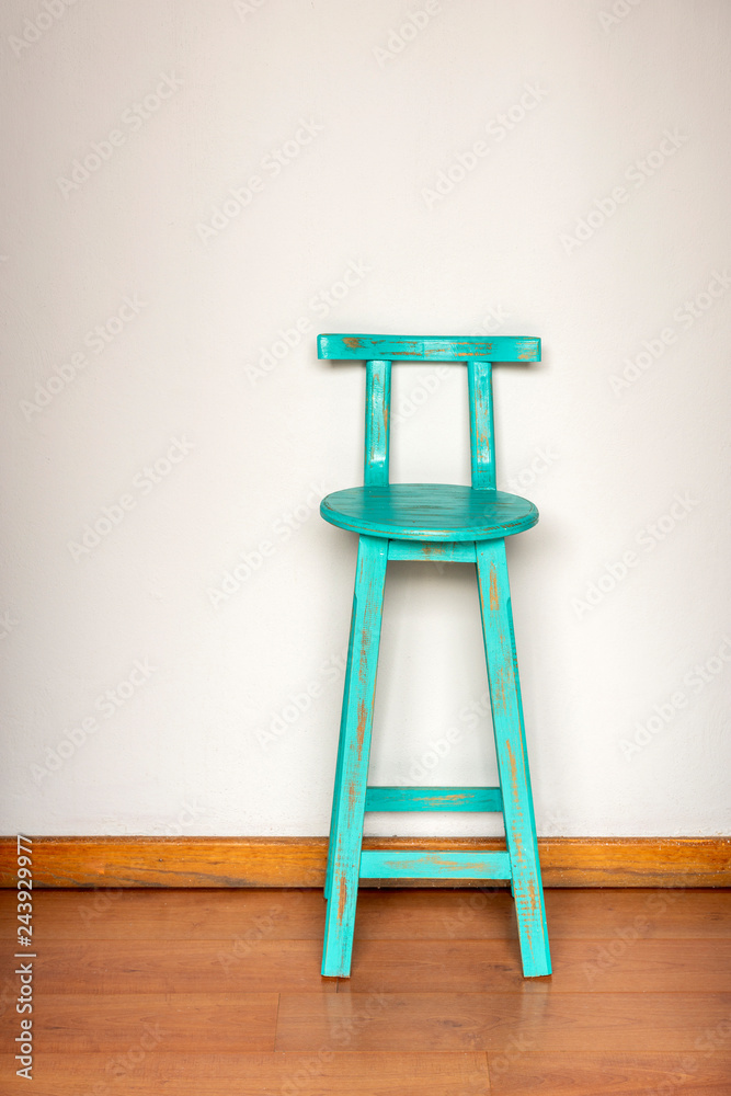 Blue Wooden Stool Against Wall Blue Wooden Stool Against Wall