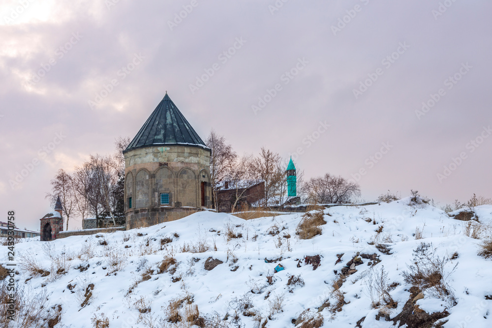 Fototapeta premium Kumbet with mosque near three kumbets in Erzurum, Turkey