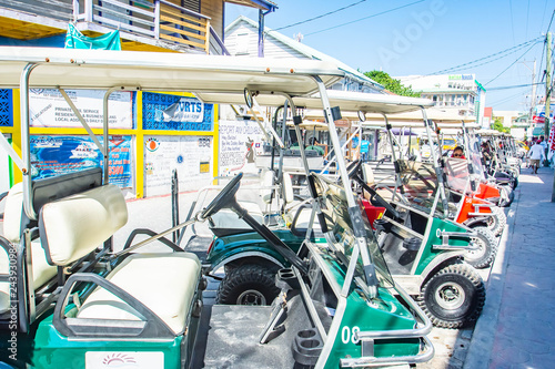 Golf carts parked in a Row photo