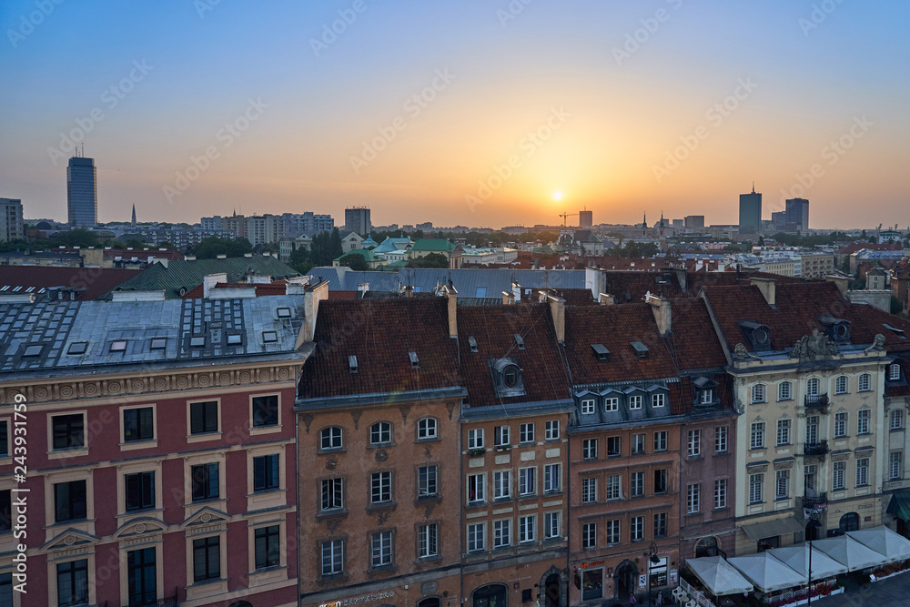 Warsaw, Poland - August 11, 2017: Beautiful panoramic view over the roofs of the Old Town to the Center of Warsaw, the Palace of culture and science (PKiN), modern skyscrapers and Krakowskie Przedmies
