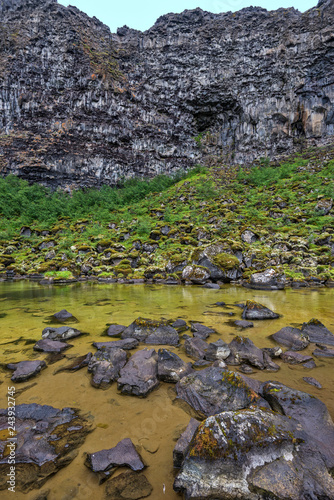 View at border of Botnstjorn lake and vertical wall of Asbyrgi Glacial Canyon in Northern Iceland. photo