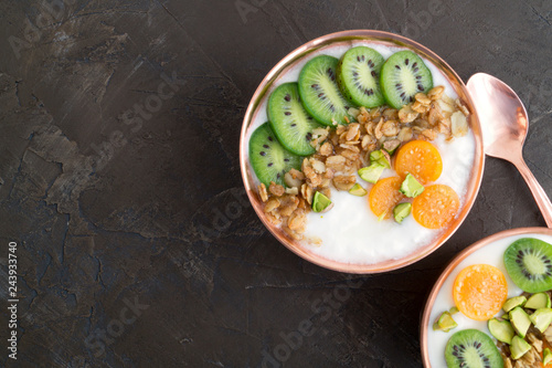 Natural healthy yogurt with muesli and fruit.