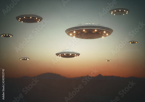 Fotografie Invasion of alien spaceships under the sky at sunset