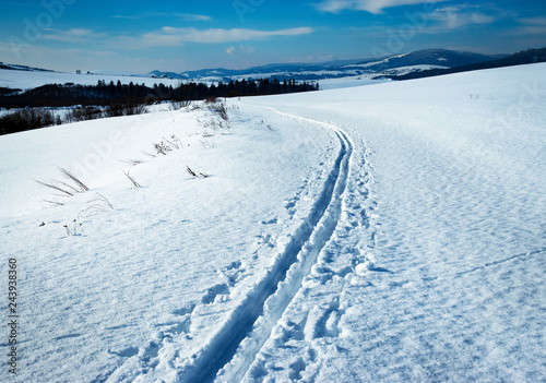 snowy winter landscape with cross country ski path © Jozef Jankola
