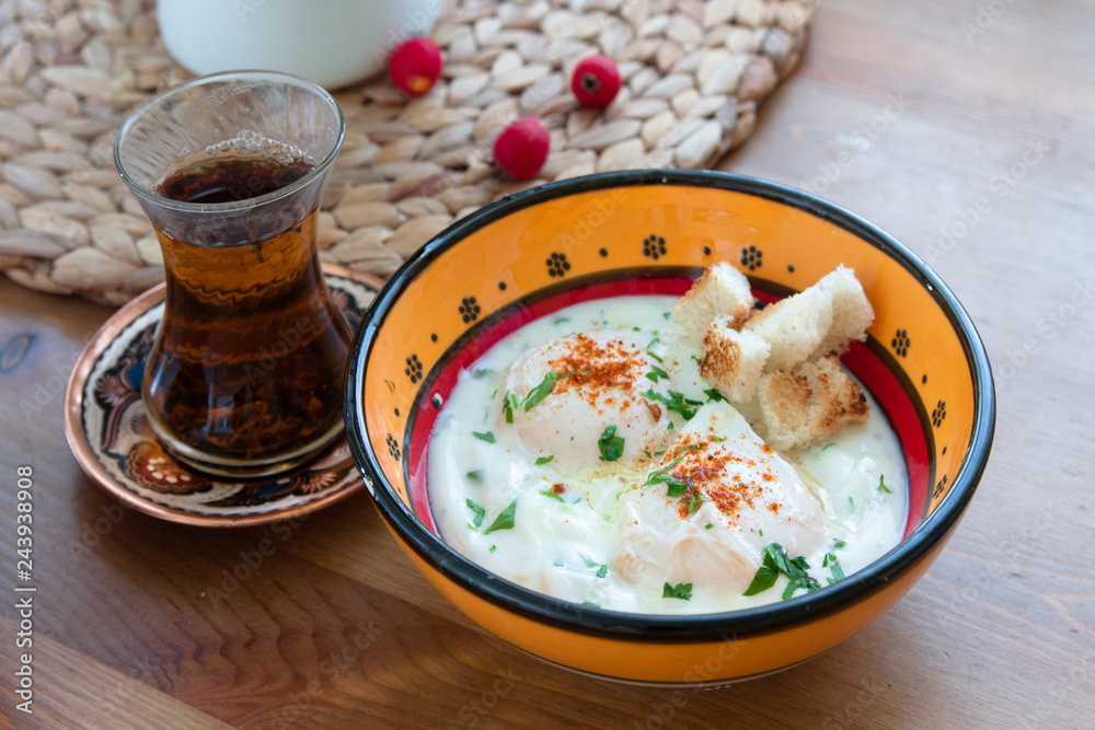 Cilbir, poached egg in yogurt with spiced butter and herbs, turkish cuisine Cilbir, poached egg in yogurt with spiced butter and herbs, turkish cuisine