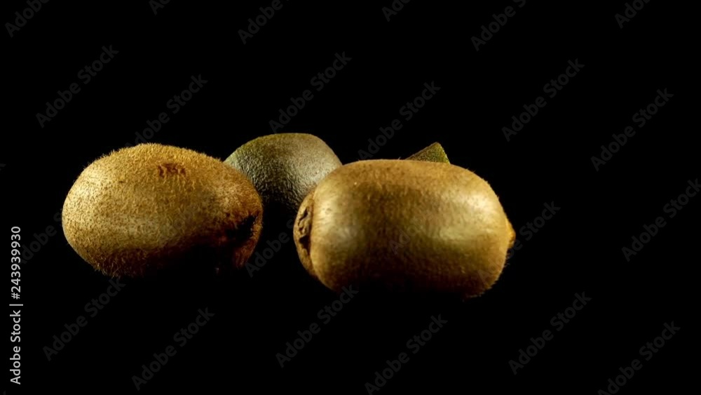 Kiwi on a black background. Shooting in the movement. Kiwi on a black background. Shooting in the movement.