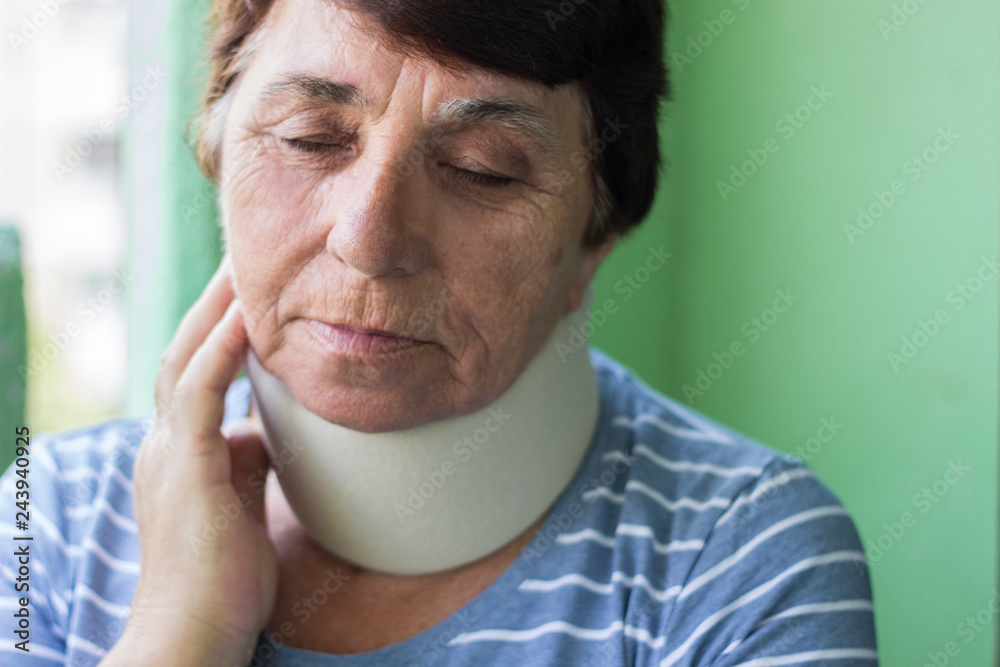Senior woman wearing neck brace Senior woman wearing neck brace