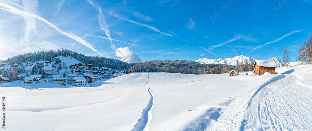 Wide panoramic view of winter landscape with snow covered trees and houses in Seefeld in the Austrian state of Tyrol. Winter in Austria - obrazy, fototapety, plakaty 