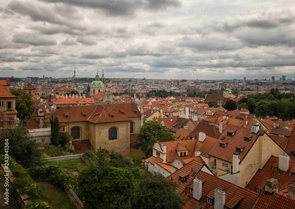 View to rooftops, dome of Saint Nicolas Cathedral and Zhizhkov TV Tower Prague Castle 