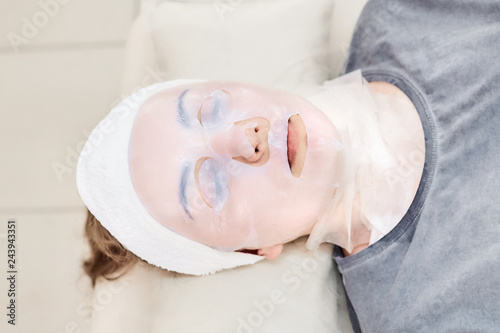 Bioсellulose Fiber Lifting Mask, Facial treatment, Cosmetic skincare procedure, Woman in a beauty salon