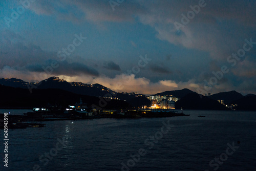 Hong Kong night view of Victoria Harbor, Hong Kong Island business district.