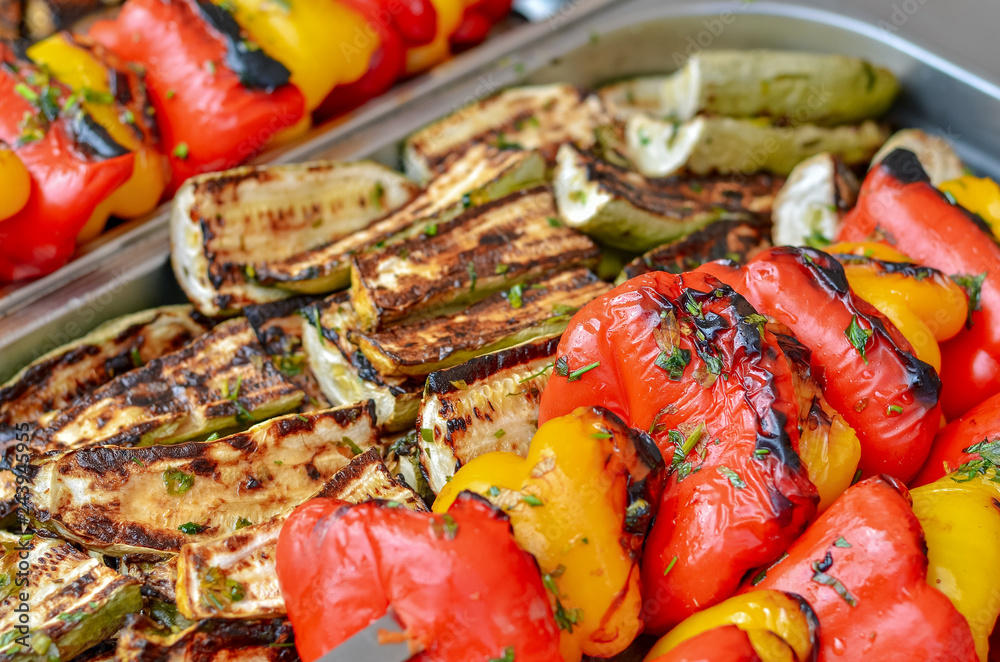 Fresh vegetables grilled on fire outdoors.