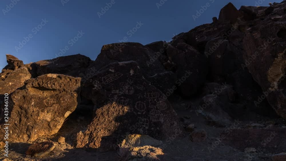 Timelapse of Morning Sun Illuminating Native American Petroglyphs -Pan Left- Timelapse of Morning Sun Illuminating Native American Petroglyphs -Pan Left-