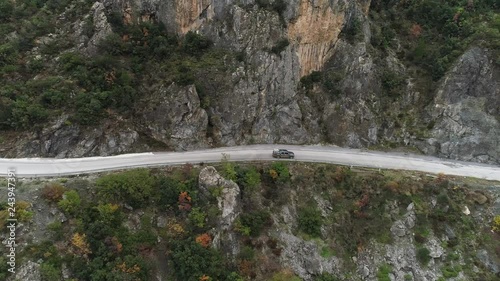 pick up driving on a small road in the mountains of greece