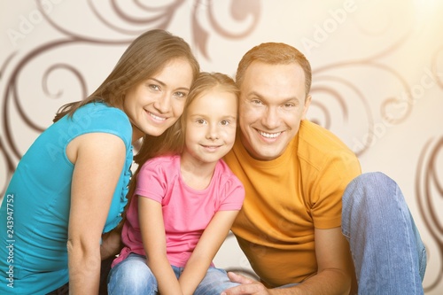 Happy cheerful family on background