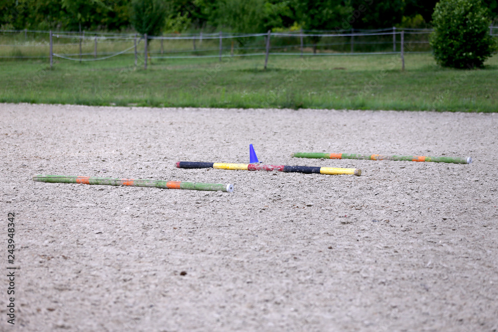 Beautiful riding field waiting for riders and horses for training Beautiful riding field waiting for riders and horses for training
