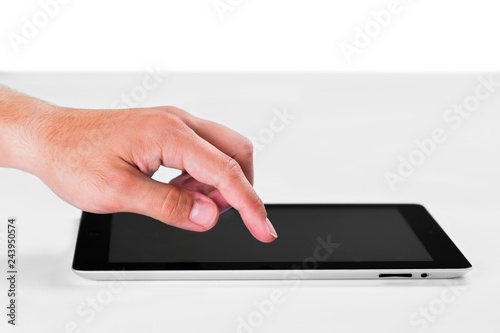 Hand Touching an iPad with Blank Screen