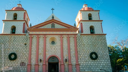 Timelapse of Tourists at Historic Church in Santa Barbra -Pan Left- photo