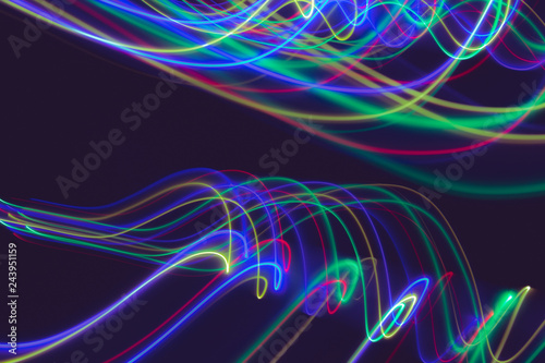 Lines of light on black background. Abstract design in the dark. © Horacio Selva