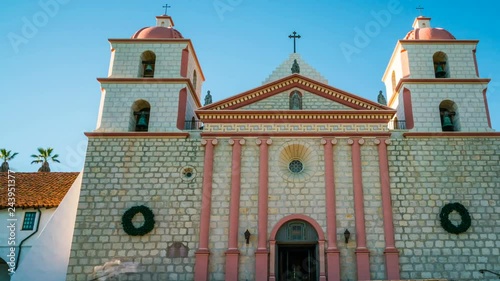 Timelapse of Tourists at Historic Church in Santa Barbra -Pan Right- photo