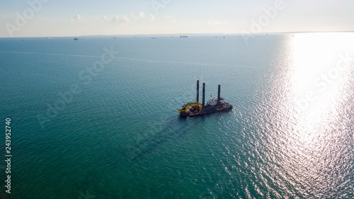 Obraz na płótnie industrial ship in sea from drone w salonie