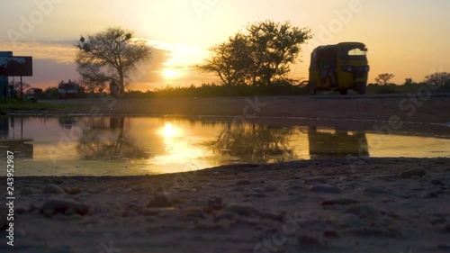 African road reflection at sunset photo